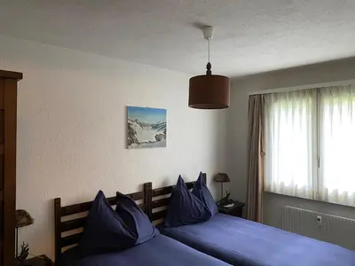 Ein Bett oder Betten in einem Zimmer der Unterkunft Superior Apartment 100m2 Bodmisonne - Grindelwald