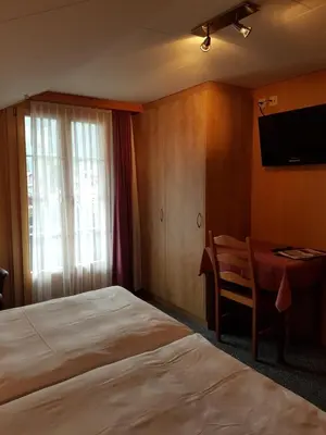 Ein Bett oder Betten in einem Zimmer der Unterkunft Hotel Garni Alpenruh