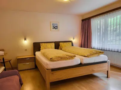 Ein Bett oder Betten in einem Zimmer der Unterkunft Apartments Atlas