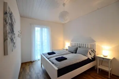 Ein Bett oder Betten in einem Zimmer der Unterkunft Interlaken Central 2