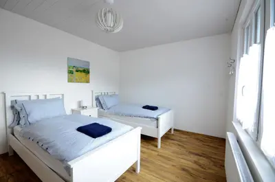 Ein Bett oder Betten in einem Zimmer der Unterkunft Interlaken Central 3