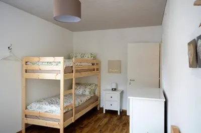 Ein Bett oder Betten in einem Zimmer der Unterkunft Interlaken Central 3