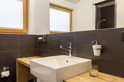 Ein Badezimmer in der Unterkunft Elite Alpine Lodge - Apart & Breakfast