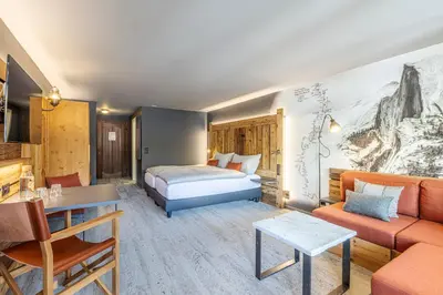 Ein Bett oder Betten in einem Zimmer der Unterkunft BaseCamp Hotel