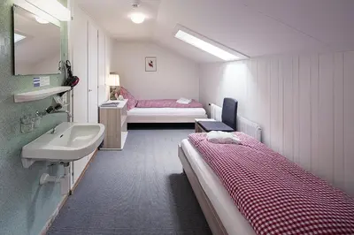 Ein Bett oder Betten in einem Zimmer der Unterkunft Basic Rooms Jungfrau Lodge