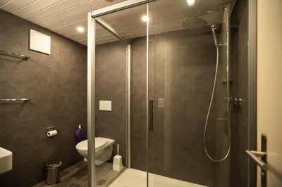 Ein Badezimmer in der Unterkunft Basic Rooms Jungfrau Lodge