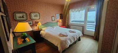 Ein Bett oder Betten in einem Zimmer der Unterkunft appartamento Melezes