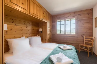 Ein Bett oder Betten in einem Zimmer der Unterkunft Aeolus MOUNTAIN & QUIET chalet 12 pers by Alpvision Résidences