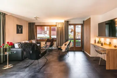 Ein Sitzbereich in der Unterkunft Central & Elegant Apartments,partially with Fireplace, by Zermatt Rental
