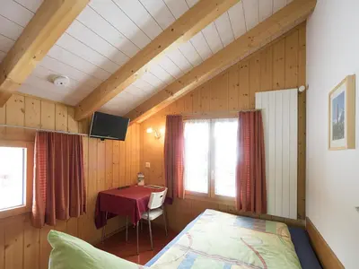 Ein Bett oder Betten in einem Zimmer der Unterkunft Esthers Guesthouse