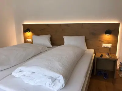 Ein Bett oder Betten in einem Zimmer der Unterkunft Hotel Walser