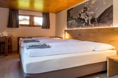 Ein Bett oder Betten in einem Zimmer der Unterkunft Hotel Walser