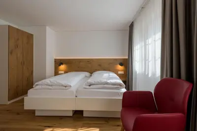 Ein Bett oder Betten in einem Zimmer der Unterkunft Hotel Walser