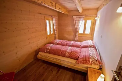 Ein Bett oder Betten in einem Zimmer der Unterkunft Appartement sous les combles - Chalet La Biolle - Vercorin