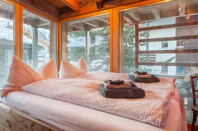 Ein Bett oder Betten in einem Zimmer der Unterkunft Chalet Schwalbennest