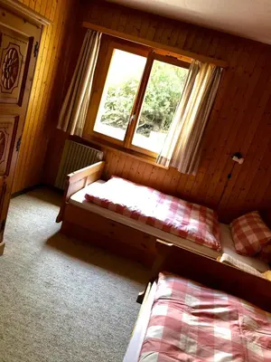 Ein Bett oder Betten in einem Zimmer der Unterkunft Alpenchalet Trutmundi undri