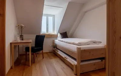 Ein Bett oder Betten in einem Zimmer der Unterkunft Hotel Belalp