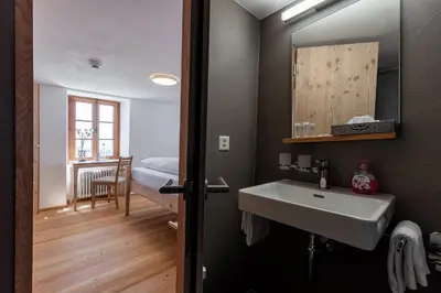 Ein Bett oder Betten in einem Zimmer der Unterkunft Hotel Belalp