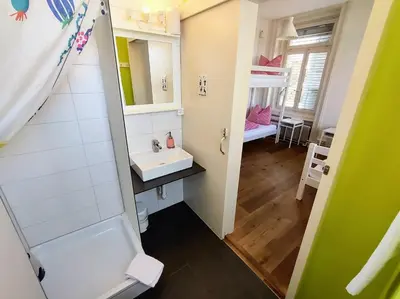 Ein Bett oder Betten in einem Zimmer der Unterkunft Adventure Hostel Interlaken