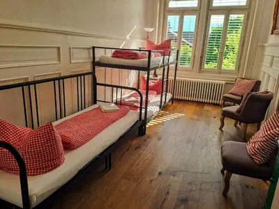 Ein Bett oder Betten in einem Zimmer der Unterkunft Adventure Hostel Interlaken