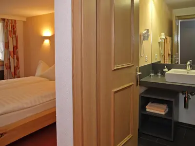 Ein Bett oder Betten in einem Zimmer der Unterkunft Hotel Steinbock