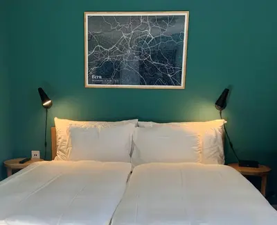 Ein Bett oder Betten in einem Zimmer der Unterkunft 5th Floor Basic Rooms - shared bathrooms