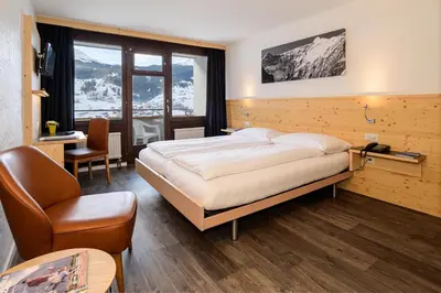 Ein Bett oder Betten in einem Zimmer der Unterkunft Jungfrau Lodge, Annex Crystal