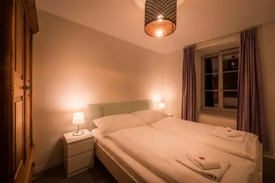Ein Bett oder Betten in einem Zimmer der Unterkunft Dependance West