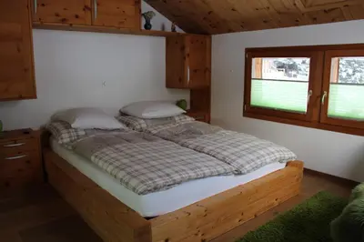 Ein Bett oder Betten in einem Zimmer der Unterkunft Chalet Gädi