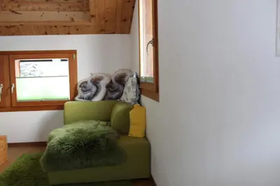 Ein Sitzbereich in der Unterkunft Chalet Gädi