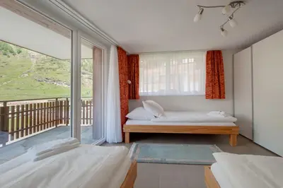 Ein Bett oder Betten in einem Zimmer der Unterkunft Haus Powder Snow