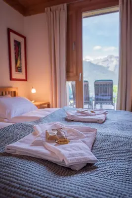 Ein Bett oder Betten in einem Zimmer der Unterkunft Chalet Roossi 2