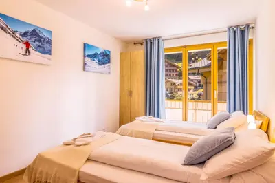 Ein Bett oder Betten in einem Zimmer der Unterkunft Chalet Aquila 2