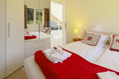 Ein Bett oder Betten in einem Zimmer der Unterkunft Chalet Hannegg Penthouse