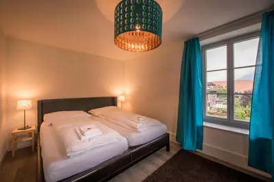 Ein Bett oder Betten in einem Zimmer der Unterkunft Dependance Penthouse
