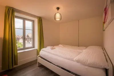 Ein Bett oder Betten in einem Zimmer der Unterkunft Dependance Penthouse