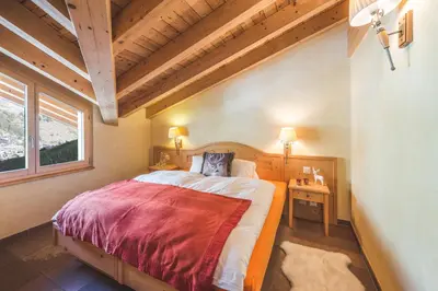 Ein Bett oder Betten in einem Zimmer der Unterkunft Apartment Alpharmonie