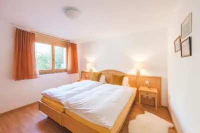 Ein Bett oder Betten in einem Zimmer der Unterkunft Apartment Alpharmonie