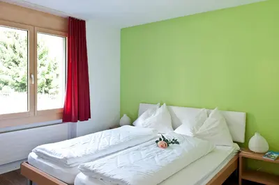 Ein Bett oder Betten in einem Zimmer der Unterkunft Pollux Family Apartment