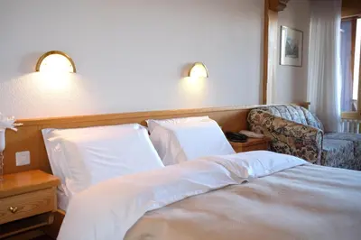 Ein Bett oder Betten in einem Zimmer der Unterkunft Hotel Restaurant Rothorn