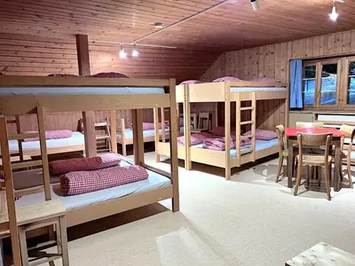 Ein Bett oder Betten in einem Zimmer der Unterkunft Jugendherberge Hospental