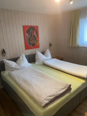 Ein Bett oder Betten in einem Zimmer der Unterkunft Ferienwohnung Allalinblick