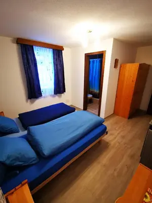 Ein Bett oder Betten in einem Zimmer der Unterkunft Sunshine