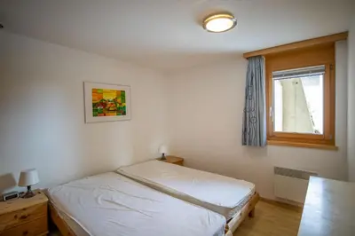 Ein Bett oder Betten in einem Zimmer der Unterkunft Bettmerlodge