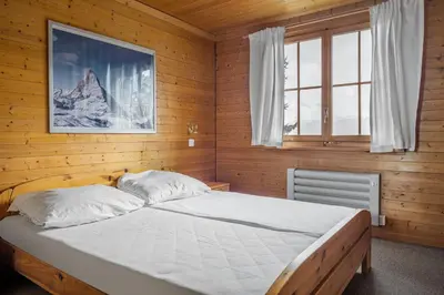 Ein Bett oder Betten in einem Zimmer der Unterkunft Brigerblick OG