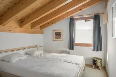 Ein Bett oder Betten in einem Zimmer der Unterkunft Camelot 5