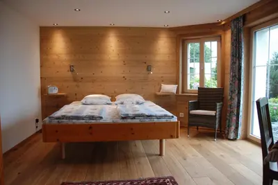Ein Bett oder Betten in einem Zimmer der Unterkunft Jobin Brienz