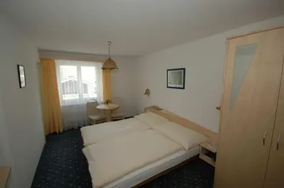 Ein Bett oder Betten in einem Zimmer der Unterkunft Hotel Alpha