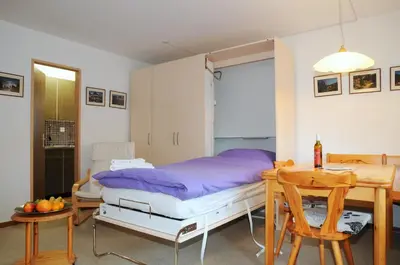 Ein Bett oder Betten in einem Zimmer der Unterkunft Alpenhaus Bettmeralp