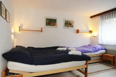 Ein Bett oder Betten in einem Zimmer der Unterkunft Alpenhaus Bettmeralp